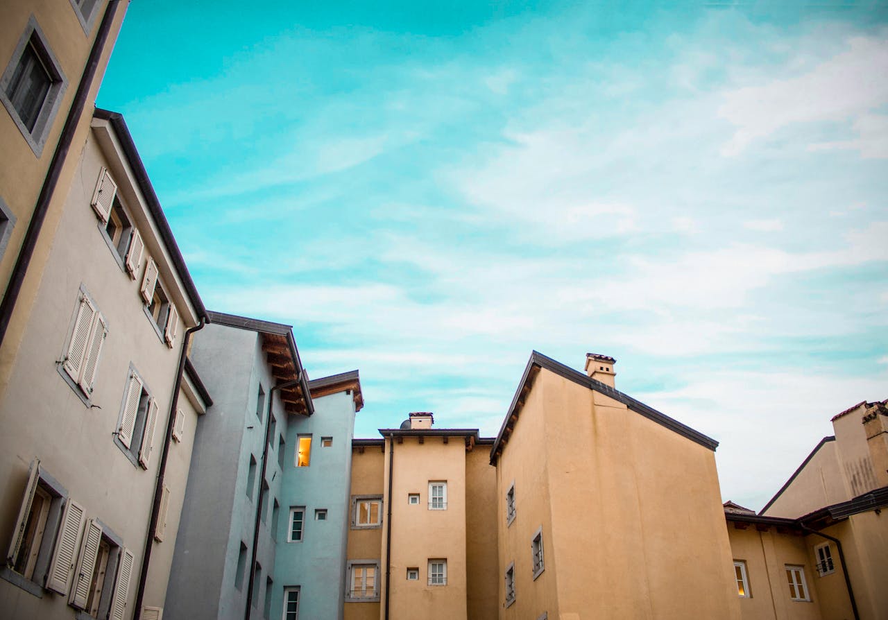 Beautiful view of traditional European architecture with pastel-colored buildings against a clear blue sky.
